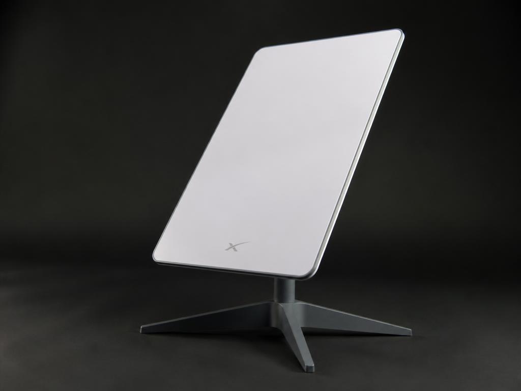 White Starlink standard satellite dish terminal on a stand